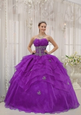 Purple Ball Gown Strapless Quinceanera Dress with Ruffled Layers